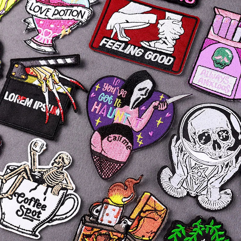 A collection of embroidered skull horror patches featuring various designs and themes.