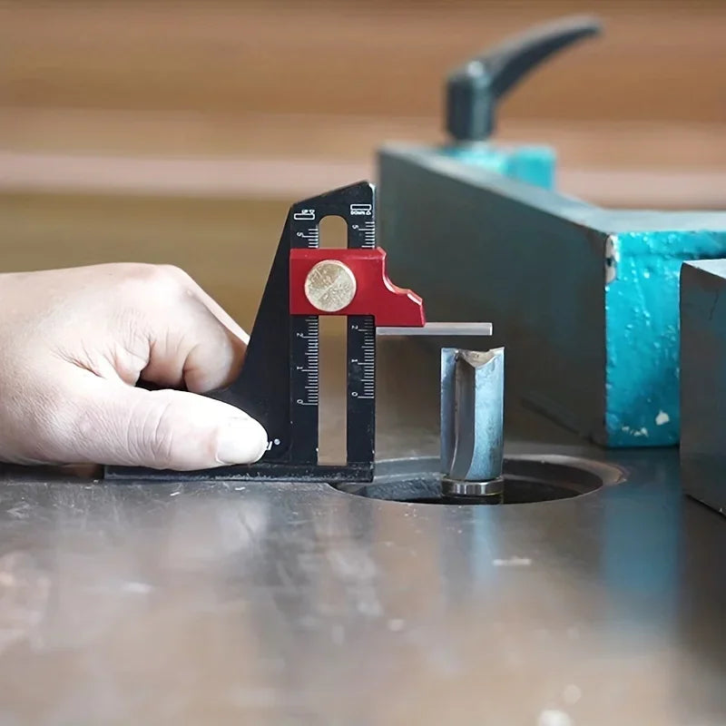 A hand adjusts a precision aluminum height setting gauge on a table saw or router table.