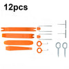 A set of 12 orange and silver auto trim removal tools and storage items.