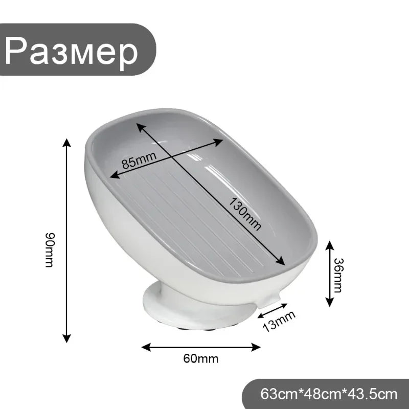 Diagram showing the dimensions of a white suction cup soap dish, including height, length, and width.