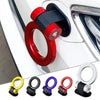 A collection of red and black sporty trailer hooks and decorative accents for cars.