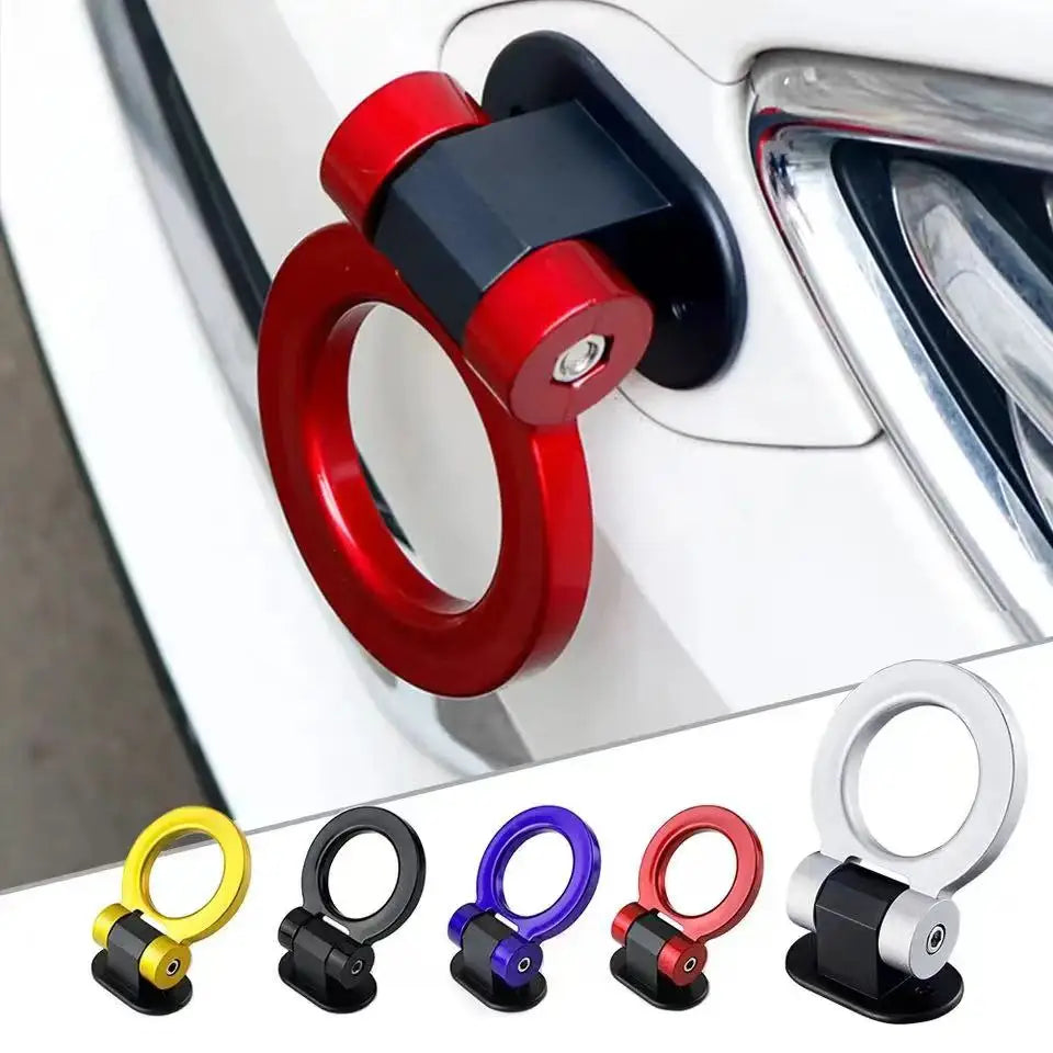 A collection of red and black sporty trailer hooks and decorative accents for cars.