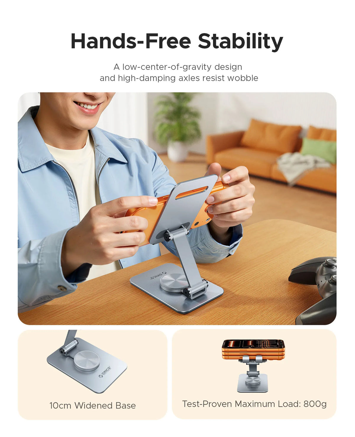 A person is using a hands-free phone stand on a wooden table, demonstrating its stability and low-center-of-gravity design.