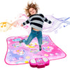 A young child is standing on a pink interactive music dance mat with lights, surrounded by musical notes.