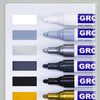 A variety of tile grout pens in different colors, including blue, gray, black, gold, and beige.