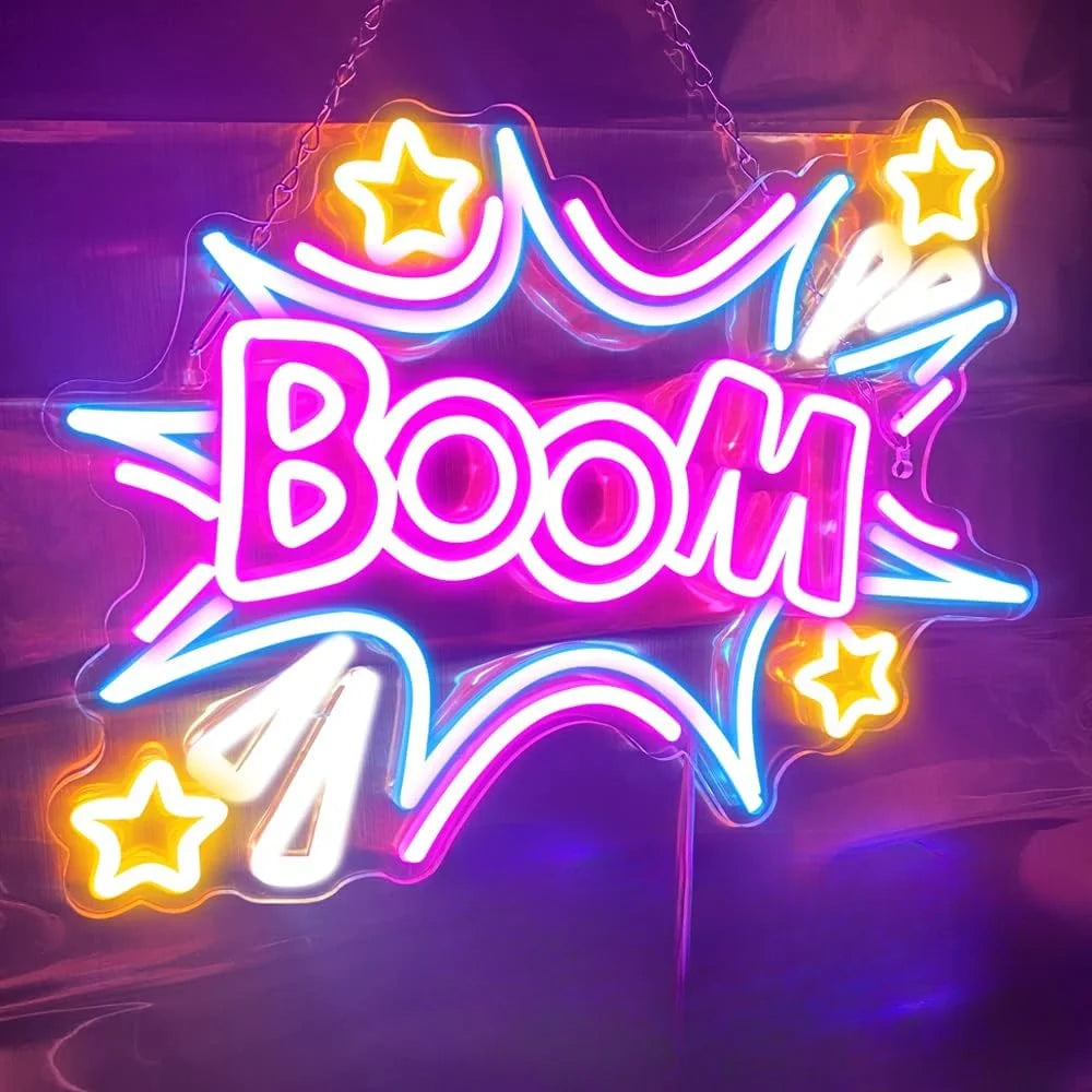 A neon sign spelling BOOM with stars and lightning bolts, illuminated in bright pink and blue light.