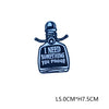A dark blue embroidered letter patch shaped like a bottle with a stopper and text reading I NEED SOMETHING YOU PROOF