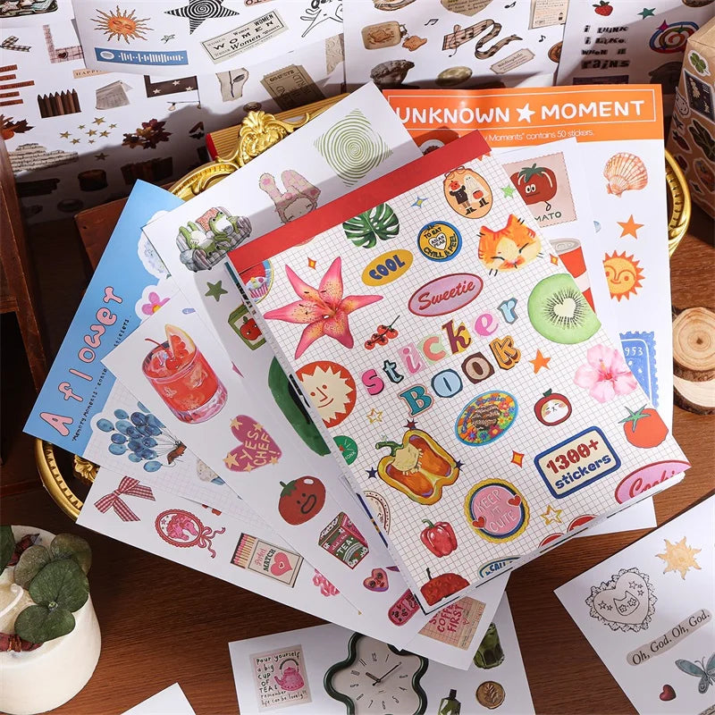 A stack of Aesthetic Nature Sticker Book featuring 50 assorted patterns for scrapbooking and DIY