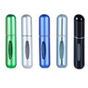A set of five travel-friendly refillable perfume spray bottles in various colors including green, silver, blue, and black.
