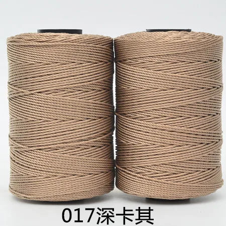 Two spools of beige 3-ply polyester knitting yarn for crochet and hand crafts