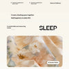 A close-up of a beige and gold printed fabric texture used for a sleep product.