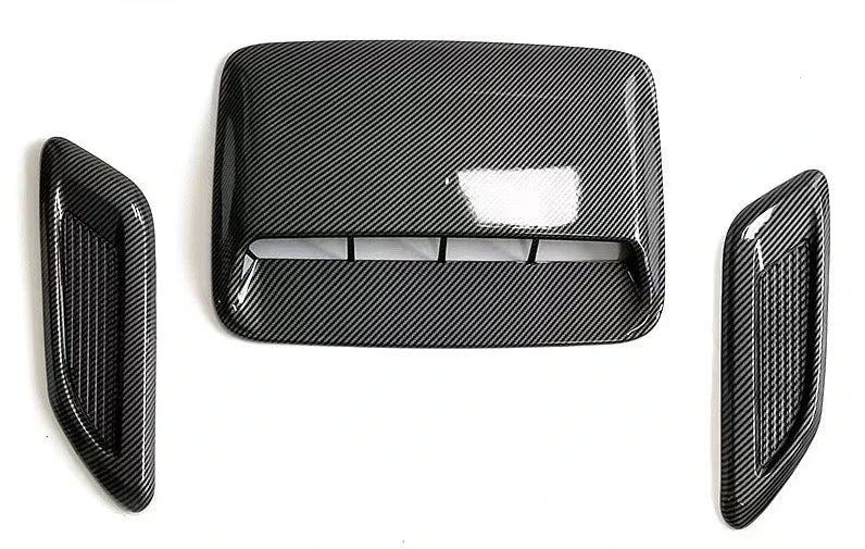 Black textured plastic hood scoop cover with a rectangular opening for air intake vent