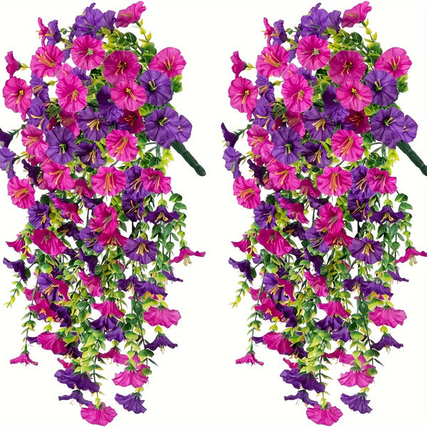 A vibrant artificial flower vine featuring purple and pink blossoms with green eucalyptus leaves.