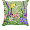 A floral fabric pillow cover featuring yellow butterflies and purple wildflowers on a green background.
