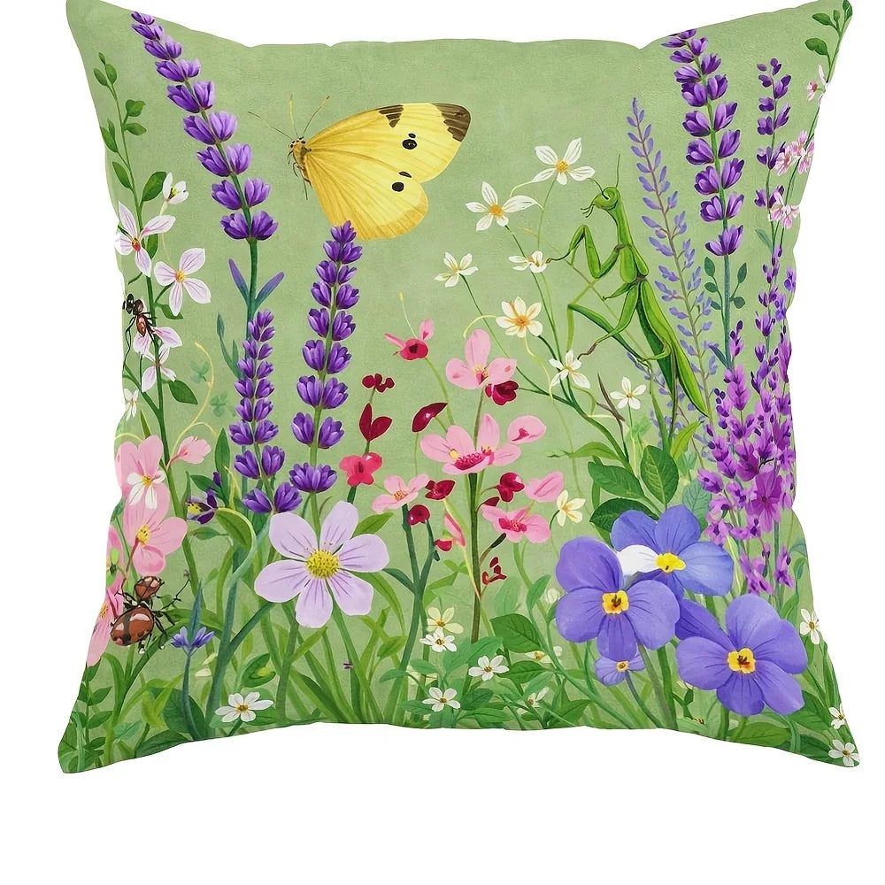 A floral fabric pillow cover featuring yellow butterflies and purple wildflowers on a green background.