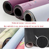 Rolls of purple and light-colored gaming mouse pad fabric showing thick precision sewing and selvedge edge