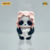 A cute blind box figure of a panda with pink hair and black and white fur, displayed against a light gray background.