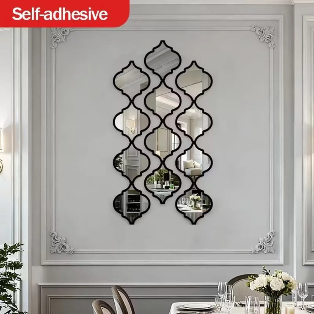Moroccan-inspired decorative mirror wall stickers in black diamond pattern on a white wall.