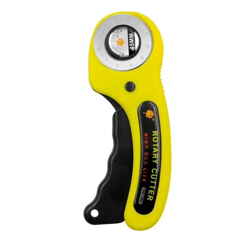 Yellow rotary cutter sewing kit with a clear measuring scale and cutting mat