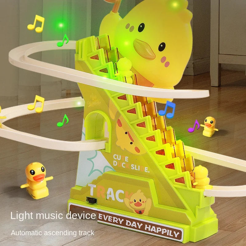 A yellow duck toy climbing a bright green plastic slide with lights and music.