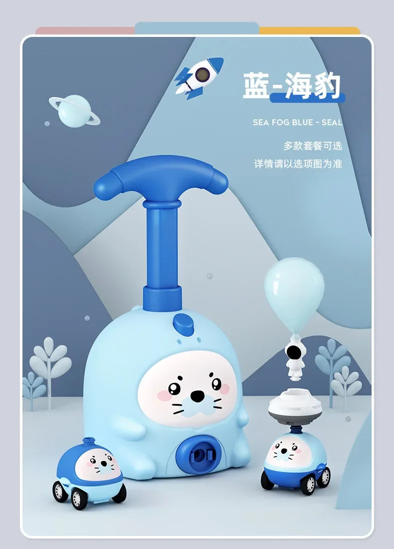 A light blue balloon-powered racing car toy is shown with an air pump and a small cat figure.