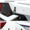 Close-up of an alloy hood pin lock kit installed on a white car, showing the mechanism securing the hood.