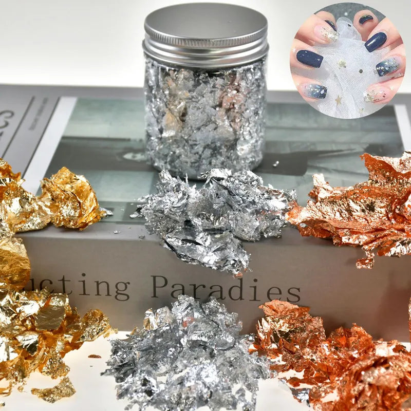 Jar of metallic foil flakes in gold, silver, and copper colors for crafting projects