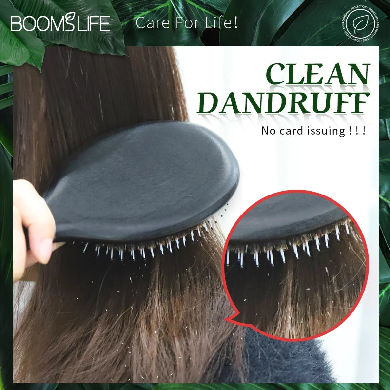 A black boar bristle hair brush is shown being used on dark brown hair, with a close-up view of the bristles.