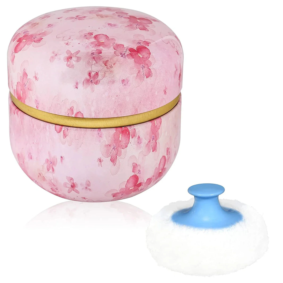 Pink refillable loose powder container with a gold band and a white travel puff applicator.