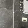 A silver silicone squeegee broom hanging on a wall, demonstrating suspension design and space saving.