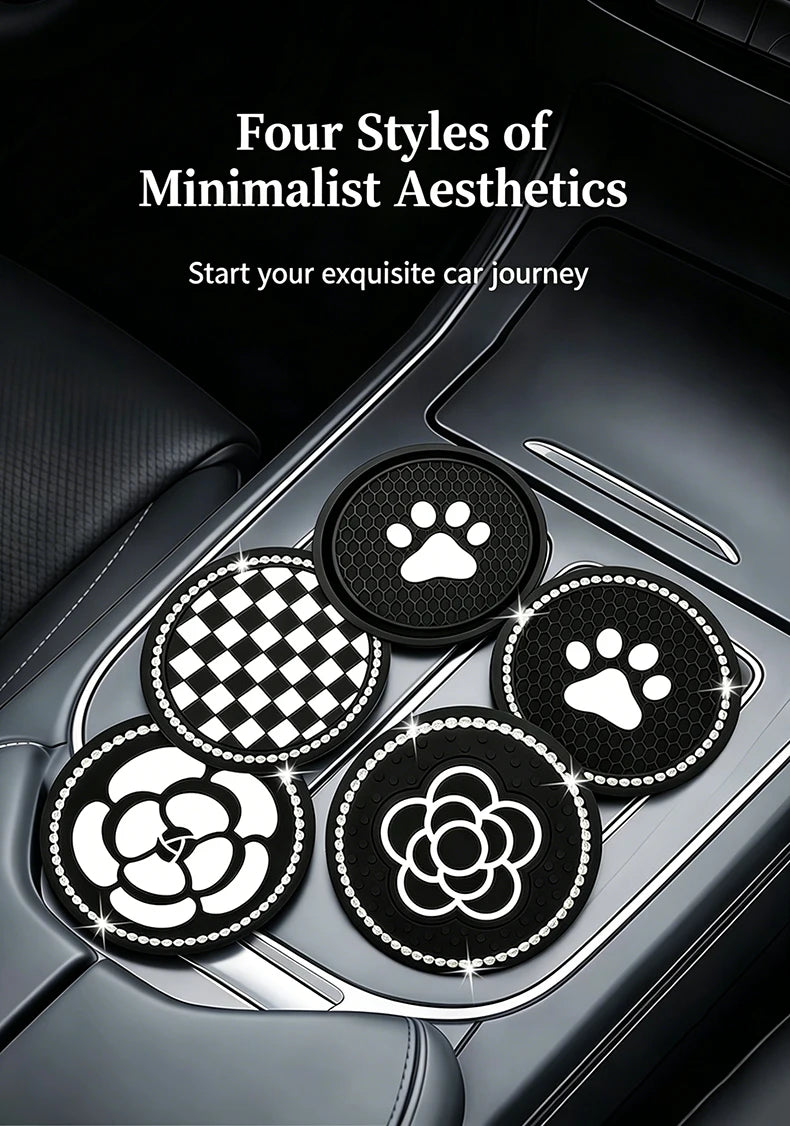 Four circular coasters featuring paw prints and camellia flower designs placed in a car cup holder.