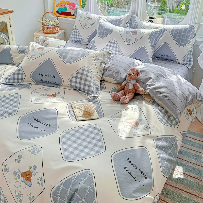 A set of light pink and gray patterned cotton duvet covers and pillow shams with happy little friends designs.