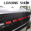 Close-up of a black Ford Bronco grille with red 3D ABS emblem letter covers.