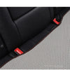 Black leather car seat cushion with red accents shown in a close-up view.