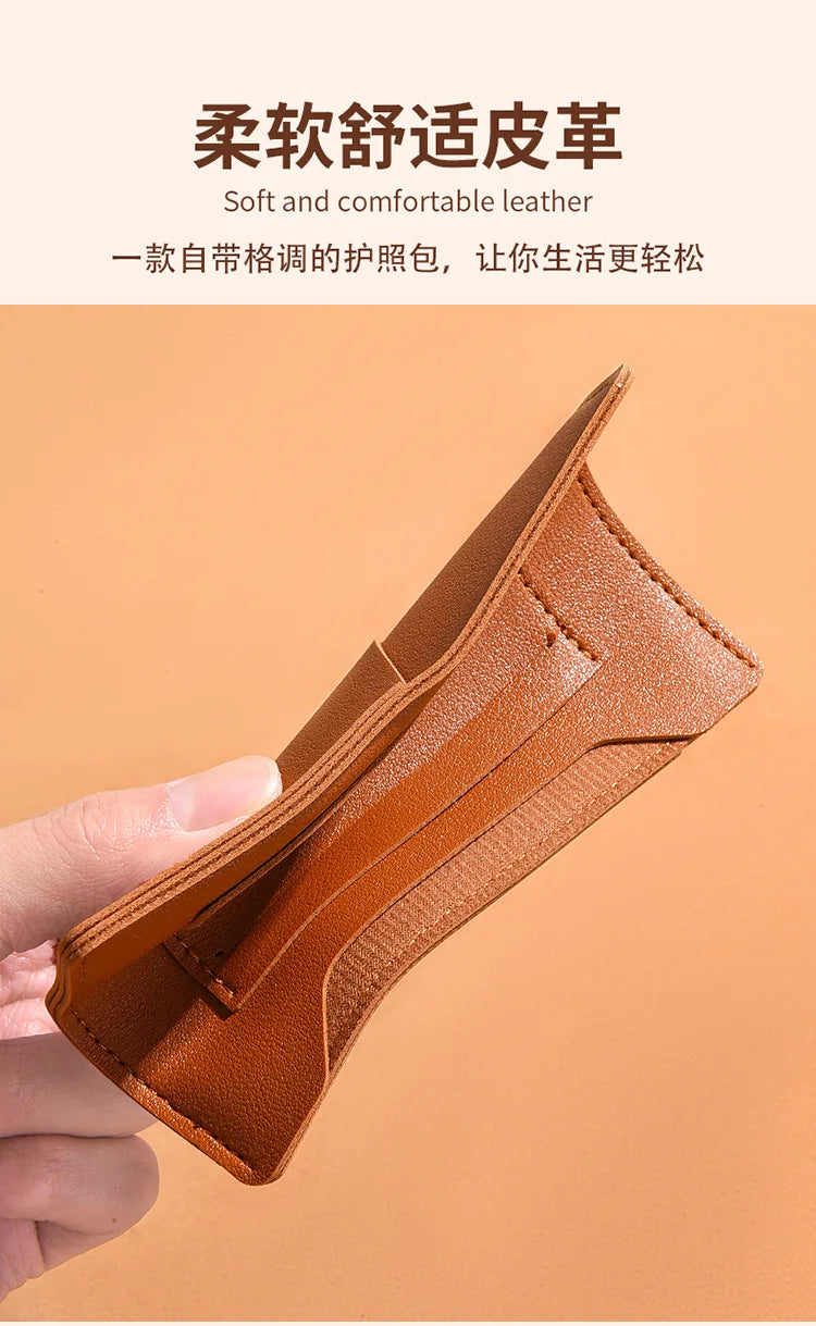 A close-up shot of a brown leather passport holder or card case being held by a hand.