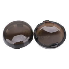 A pair of smoked brown LED turn signal light lens covers for Harley Davidson motorcycles.
