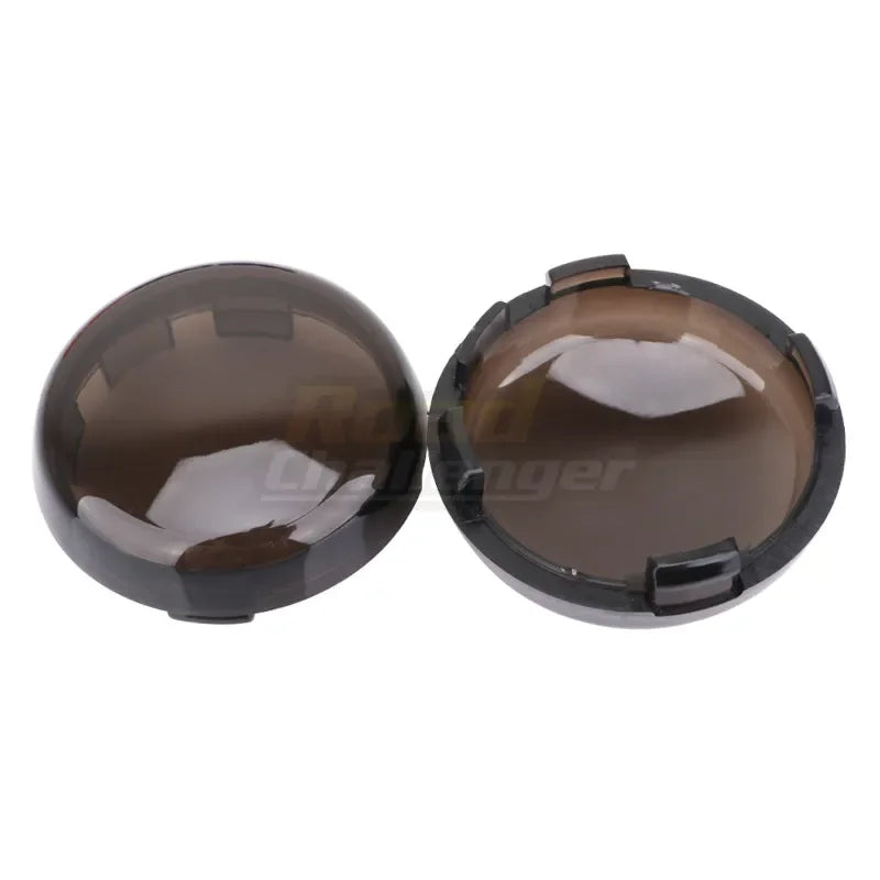 A pair of smoked brown LED turn signal light lens covers for Harley Davidson motorcycles.