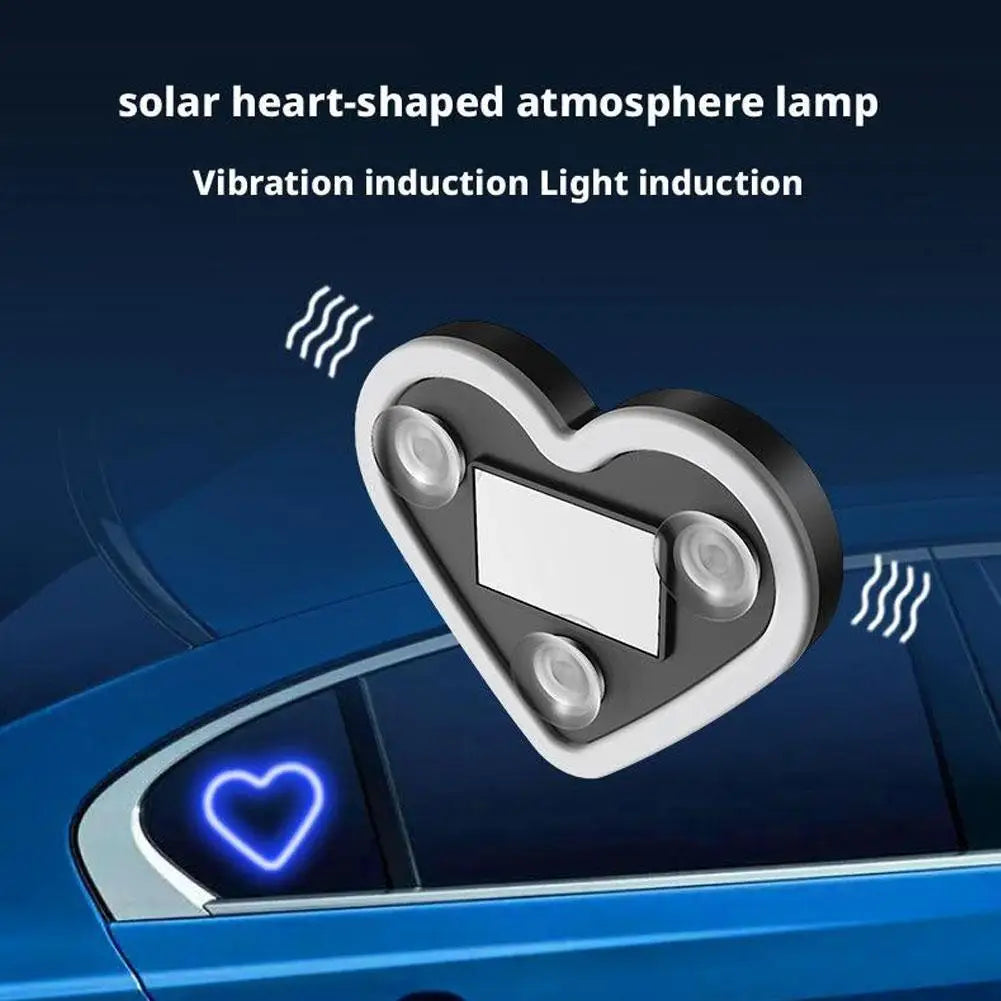 A heart-shaped solar lamp with neon light is shown mounted on a car window.