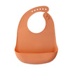 A terracotta orange silicone baby bib with a catch pocket for feeding