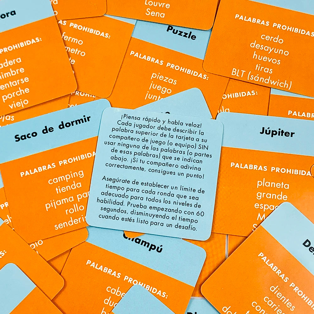 A close-up of a box of orange and yellow cards for the Name That Word Spanish Edition card game