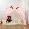 Pink checkered teepee play tent with a bear decoration and string lights for kids