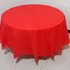 A vibrant red disposable round tablecloth is displayed on a table.