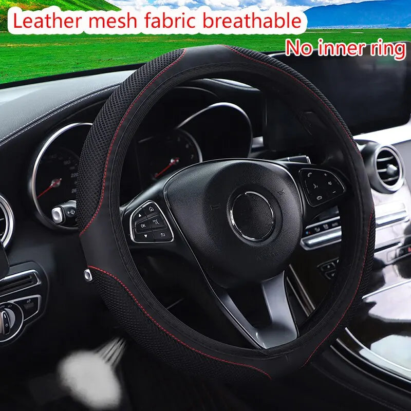 Black leather mesh fabric steering wheel cover with red stitching and diamond accents shown in a car interior.