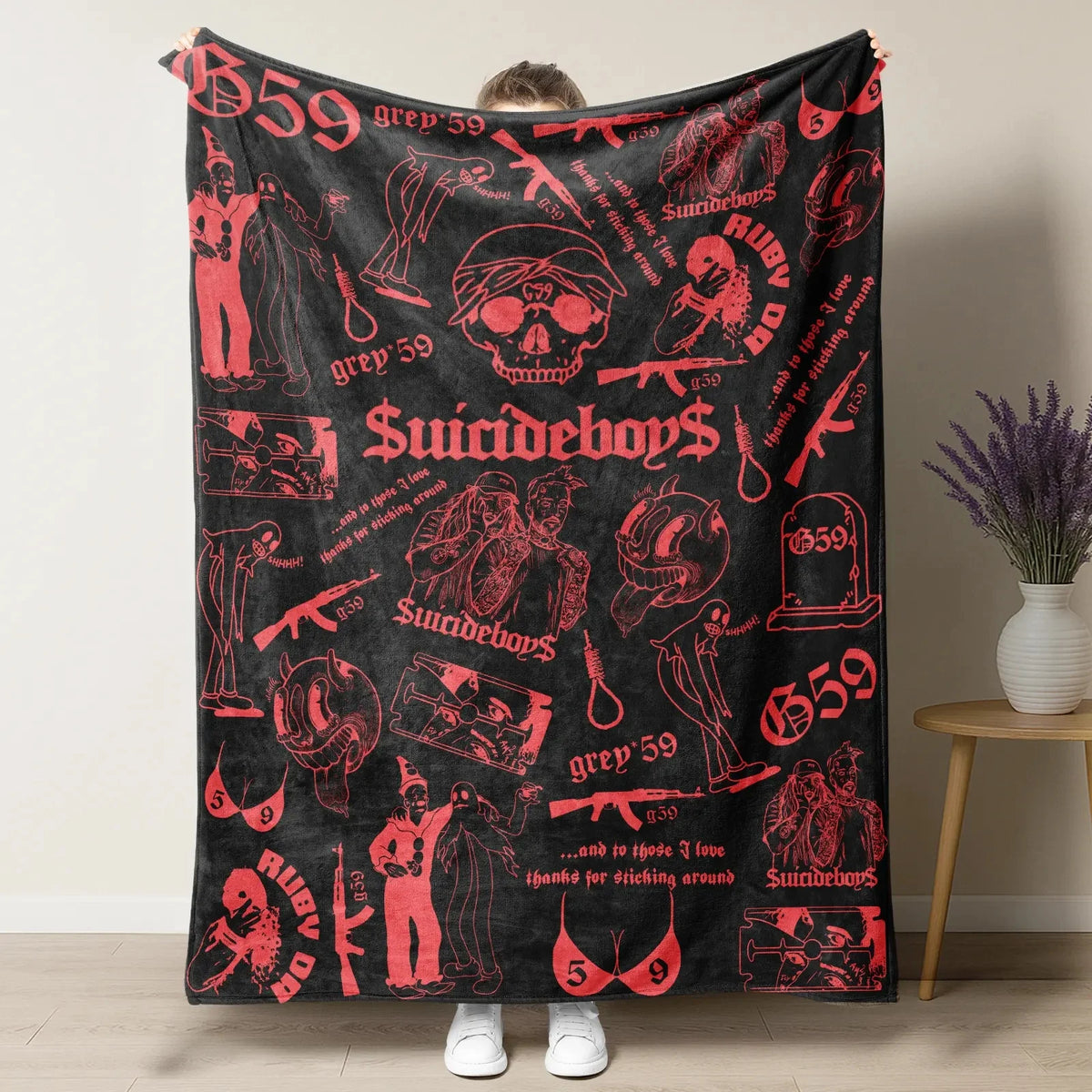 A black throw blanket featuring retro skull and clown horror art with text like Suicideboy and ruby