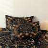 A dark brown and gold tribal dreamcatcher duvet cover set with a matching pillowcase