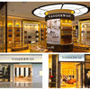 A display featuring an elegant large-capacity leather handbag and a matching coin purse in a retail setting.