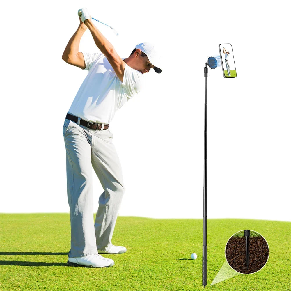 A golfer is using a magnetic tripod to hold a smartphone for filming or photography on a golf course.