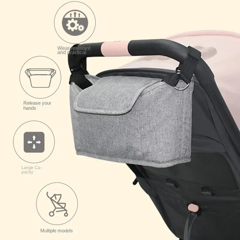 A gray organizer bag with a cup holder is shown attached to a stroller, highlighting its features.