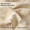 Close-up of a beige 6-layer yarn weaving fabric showing bubble attructure for a soft muslin cotton blanket.