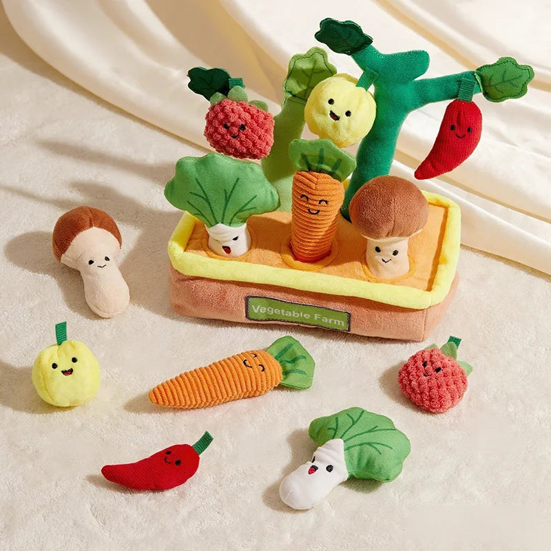 A set of felt vegetable toys including a carrot, tomato, and mushroom, arranged on a white surface.